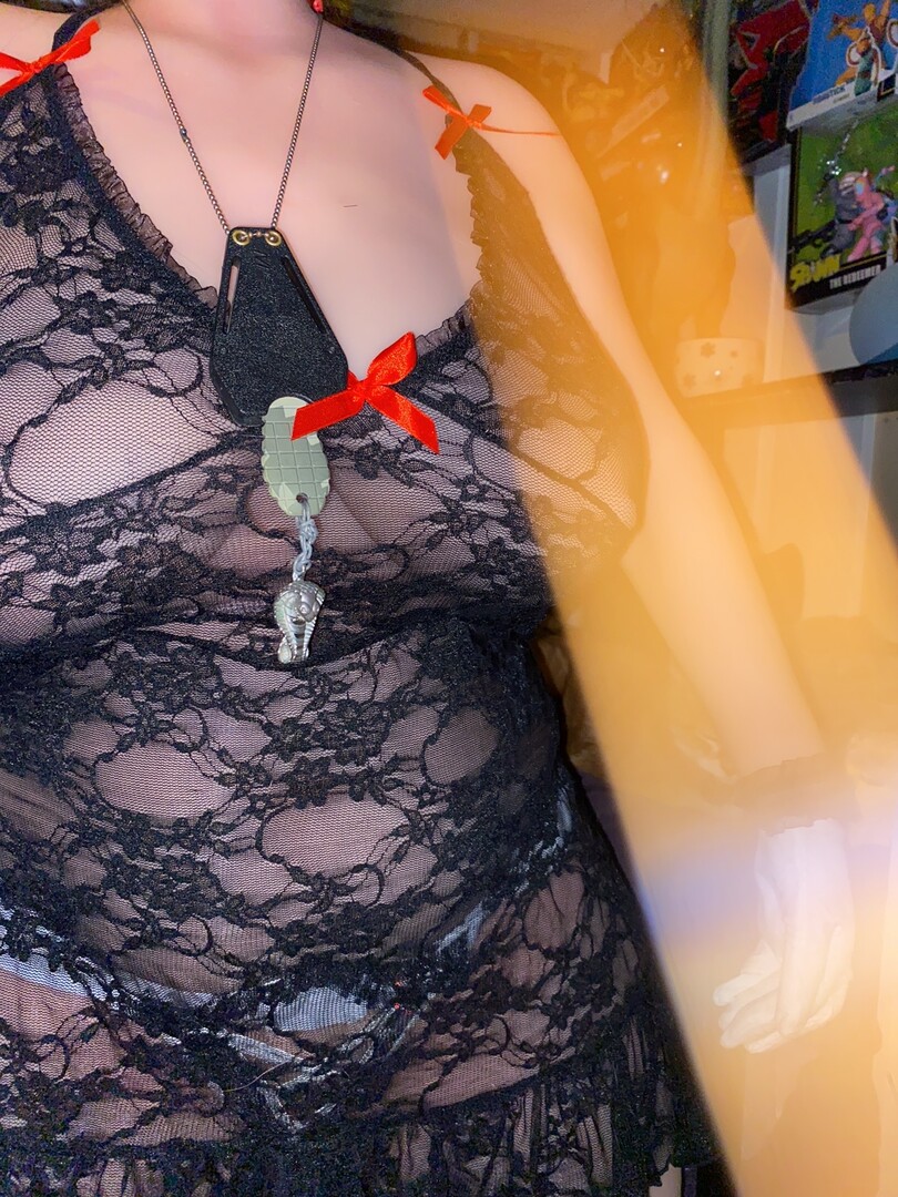 black lace, red ribbons and green pendant.JPG