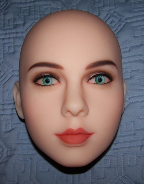 The head, unwrapped.<br />I wasn't expecting this quality of makeup on custom dolls. I thought it was only done for predesigned models. This was a pleasant surprise.